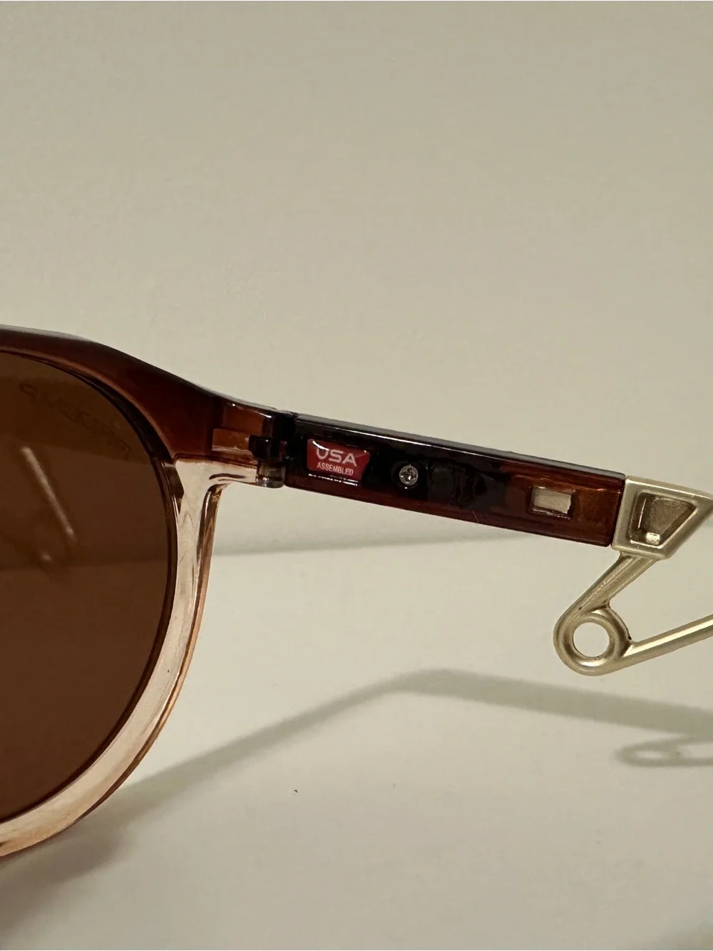 Oakley Men’s Brown Lensed Sunglasses with Gold Temple Accents
